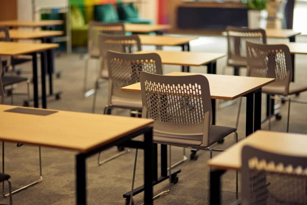 Empty classroom or conference room with desks and chairs